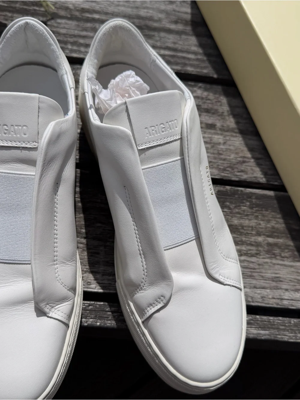 Axel Arigato White Leather Slip-On Sneakers with Gold Logo